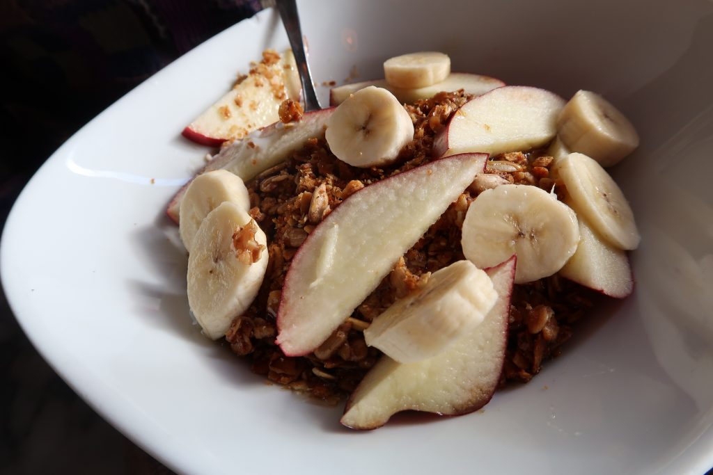 A bowl of house made granola with yogurt, bananas and pears from Fat Hen in Seattle, WA